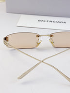 Balenciaga sunglasses, light tan lenses and gold-tone metal bridge