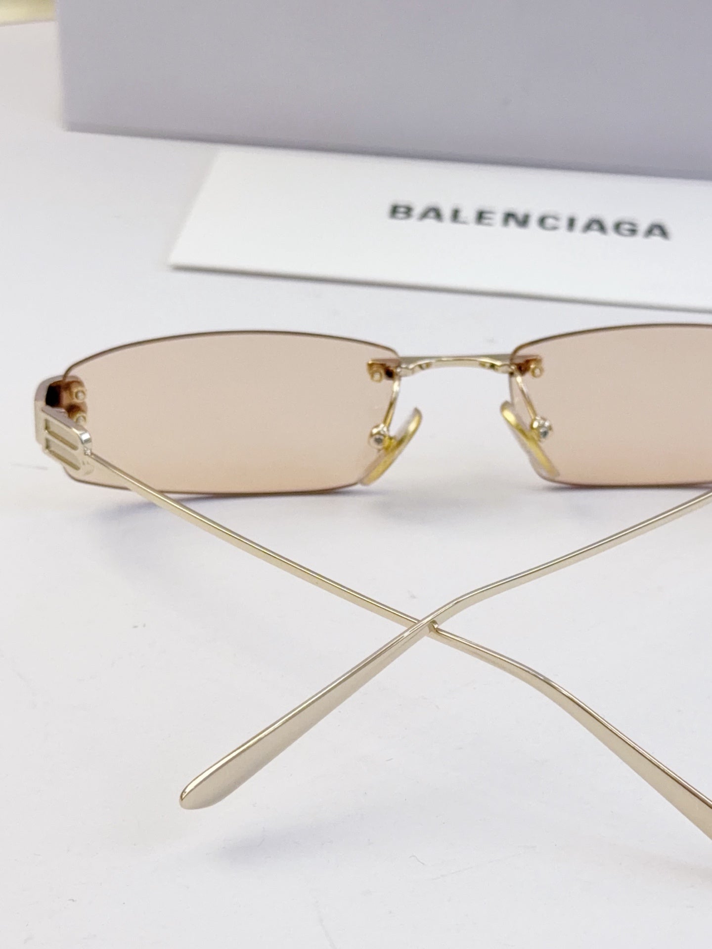 Balenciaga sunglasses, light tan lenses and gold-tone metal bridge