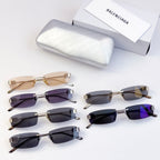 Balenciaga sunglasses set, mixed dark and tan lenses with gold-tone frames