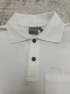 White polo collar with two black buttons and Dior logo on chest
