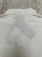 White polo shirt back with vented hem