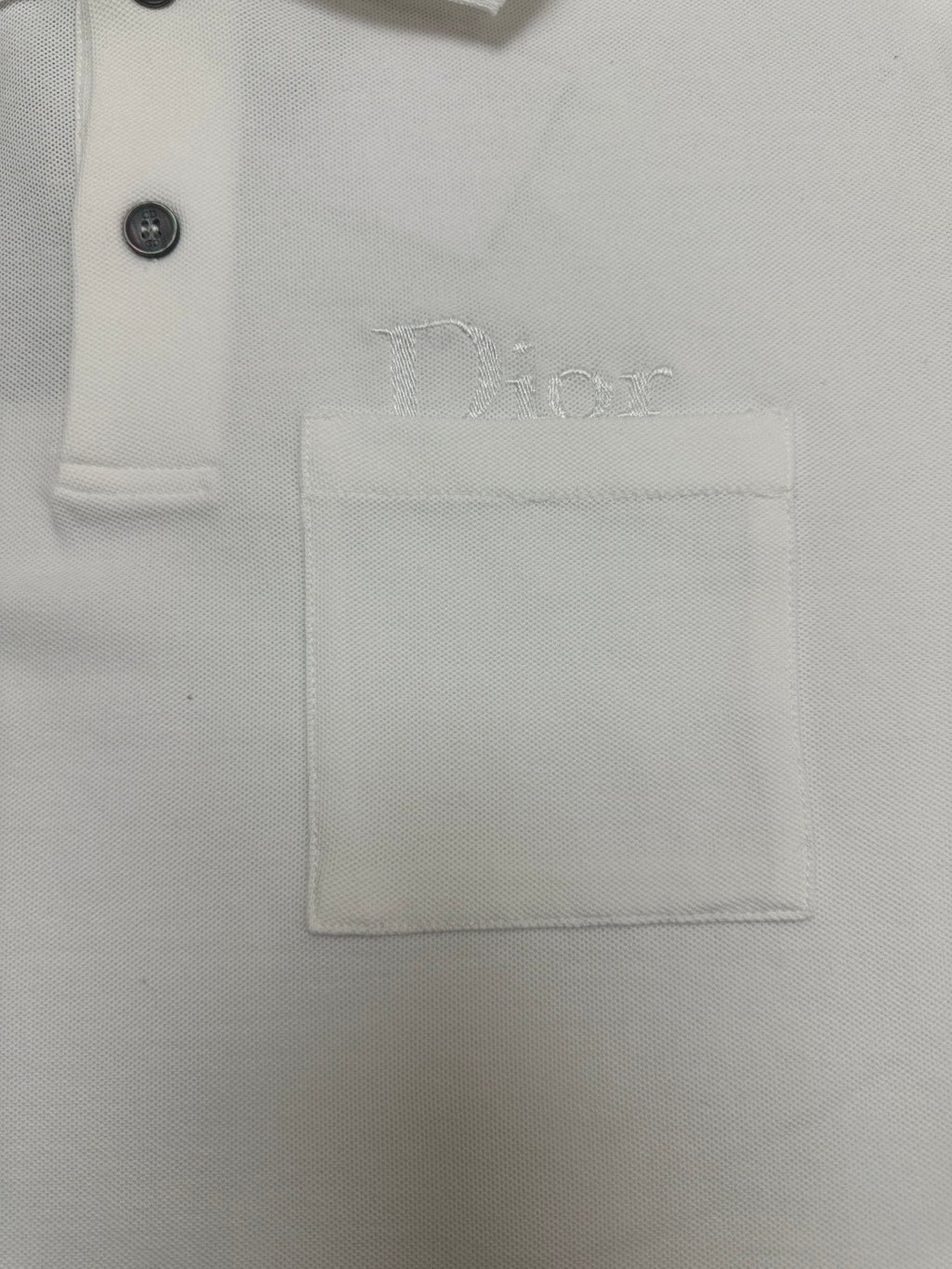 White polo chest pocket with embroidered Dior logo