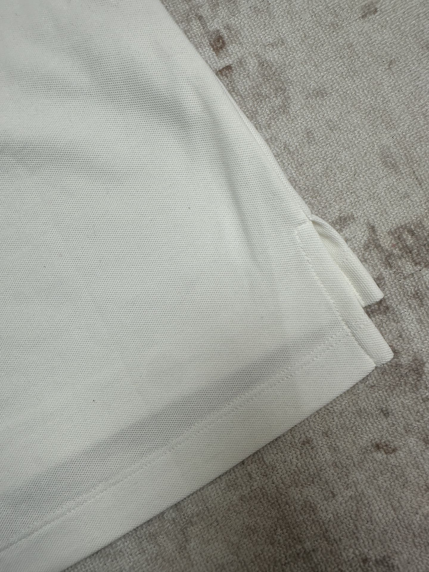 White polo sleeve cuff and side seam