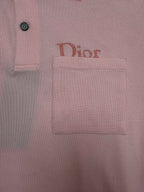 Pink Dior polo shirt logo patch on chest area, with button detail