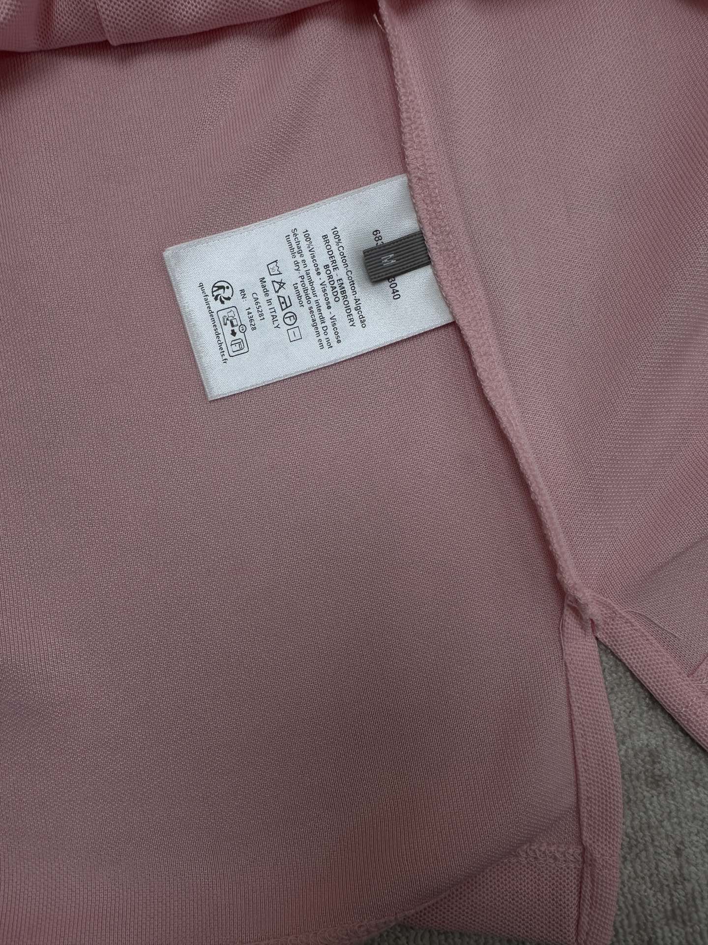 Pink Dior polo shirt inner neck label and stitched seam close-up