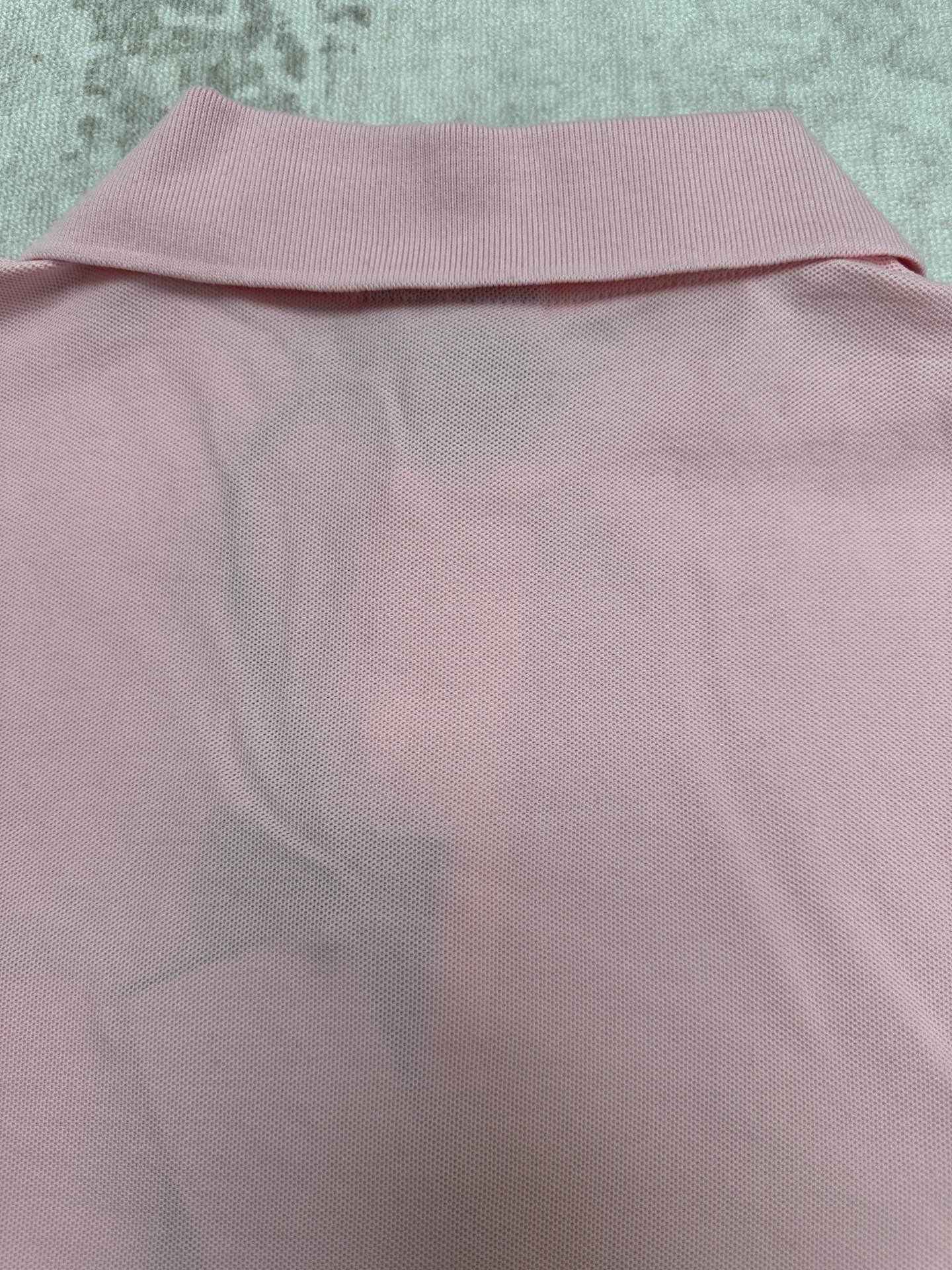 Pink Dior polo shirt back with ribbed collar hem close-up