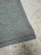 Heather gray short-sleeve polo shirt sleeve and curved hem detail
