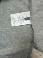 Heather gray polo shirt care label tag inside near side seam