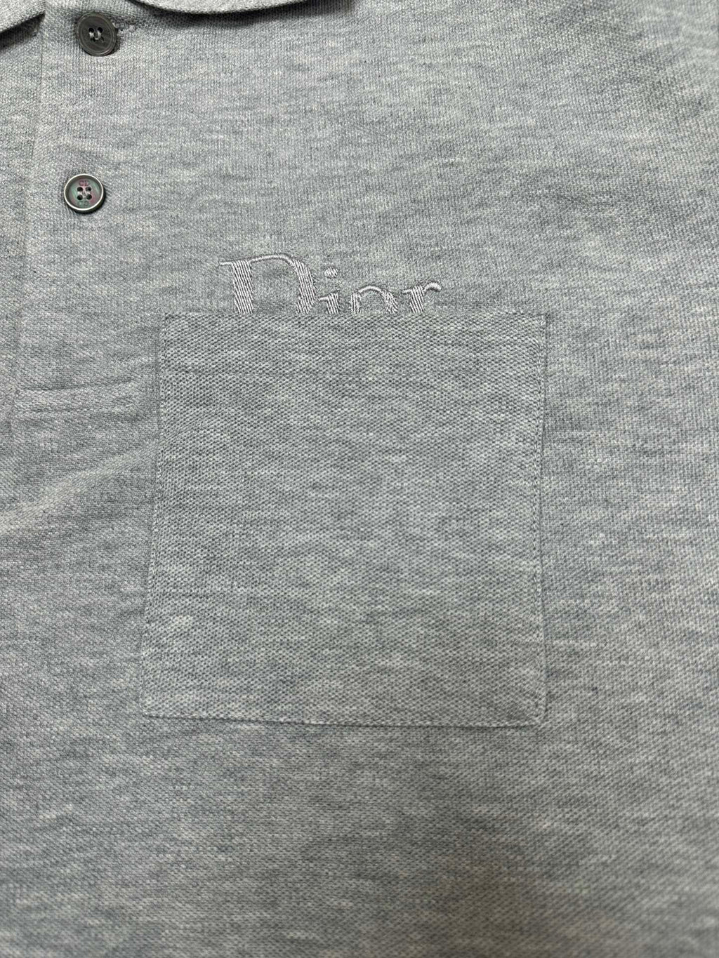 Heather gray polo shirt with chest logo, pocket, and two-button front