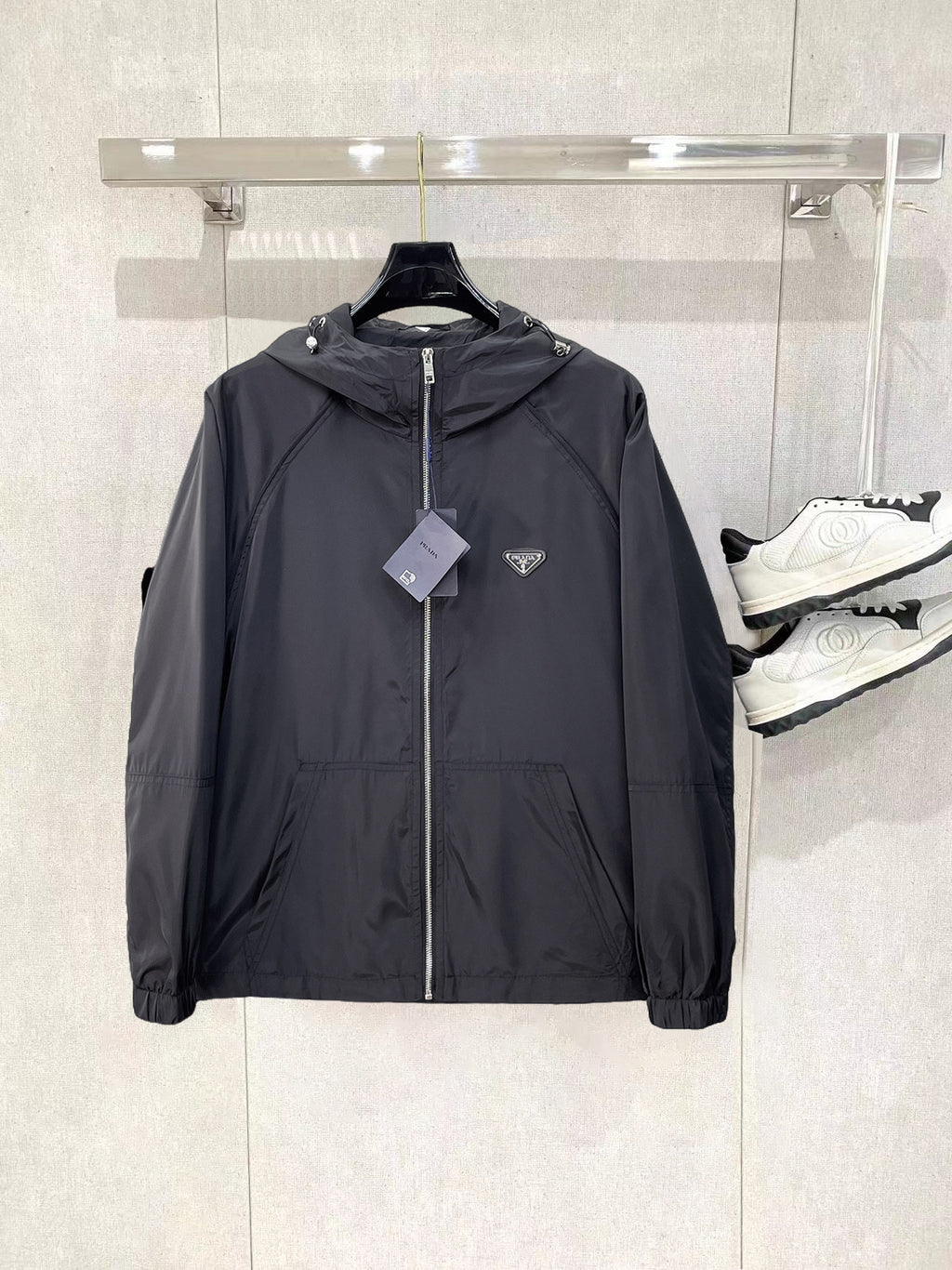 Long hooded zip jacket in dark gray with front patches and drawstring collar