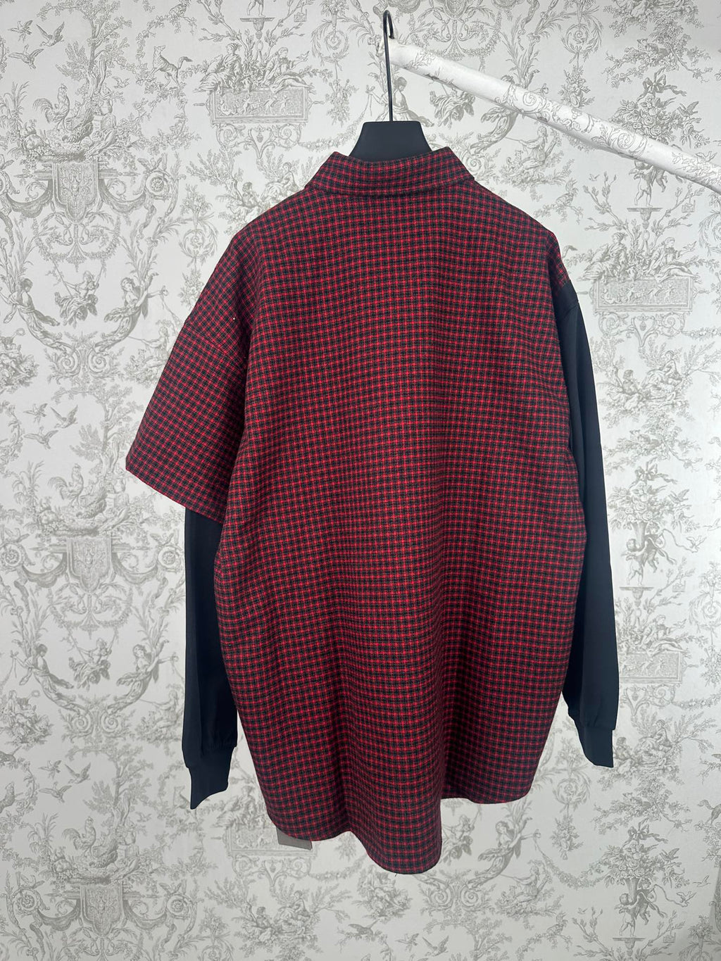 Long-sleeve shirt with red-and-black plaid body and dark navy side panels, button collar