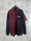 Long-sleeve shirt with red-and-black plaid front, dark navy sleeves, and button-up collar