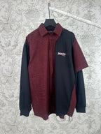 Long-sleeve shirt with red-and-black plaid front, dark navy sleeves, and button-up collar