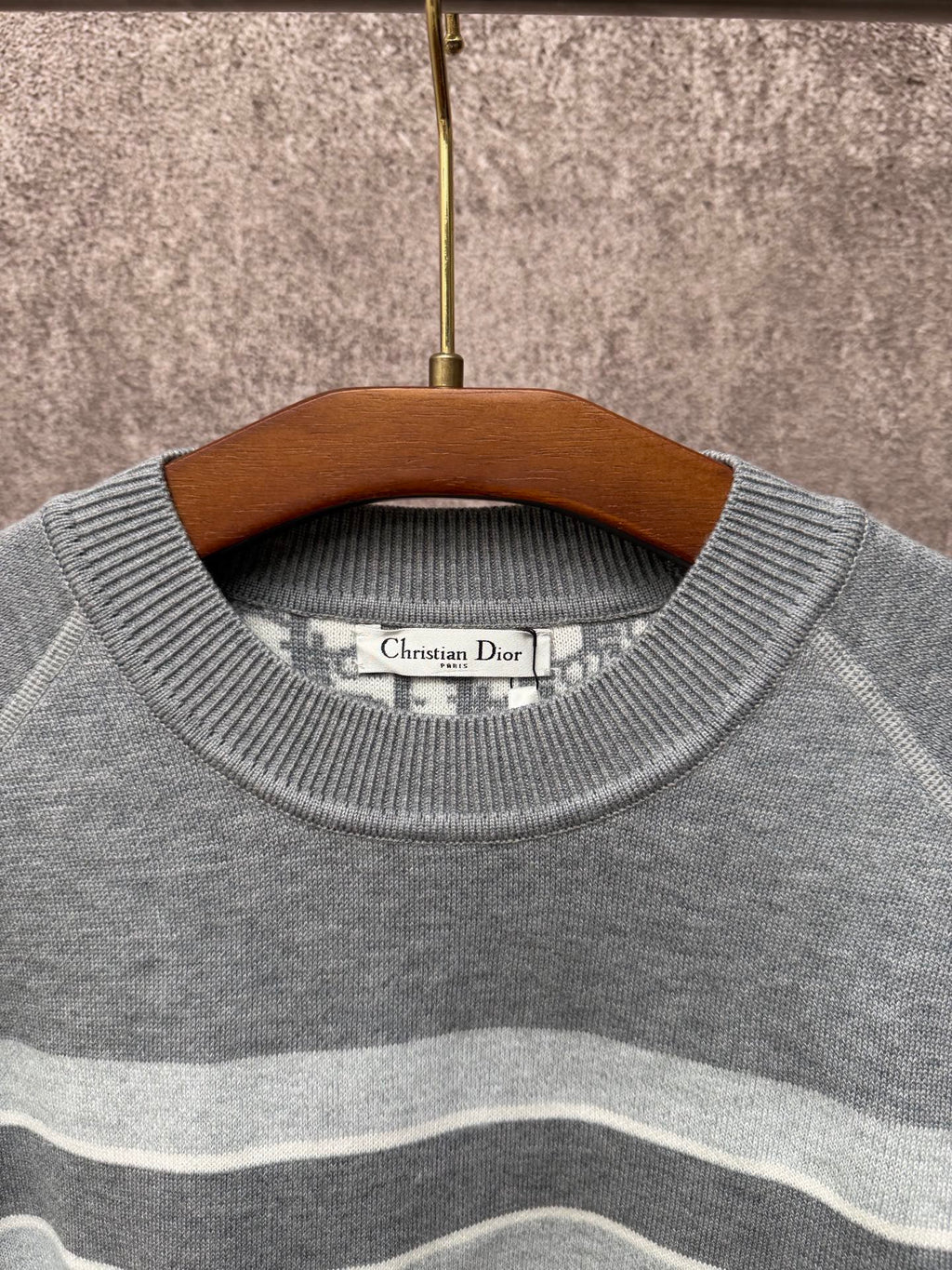 Gray knit sweater crew neck with Christian Dior label and light blue stripes
