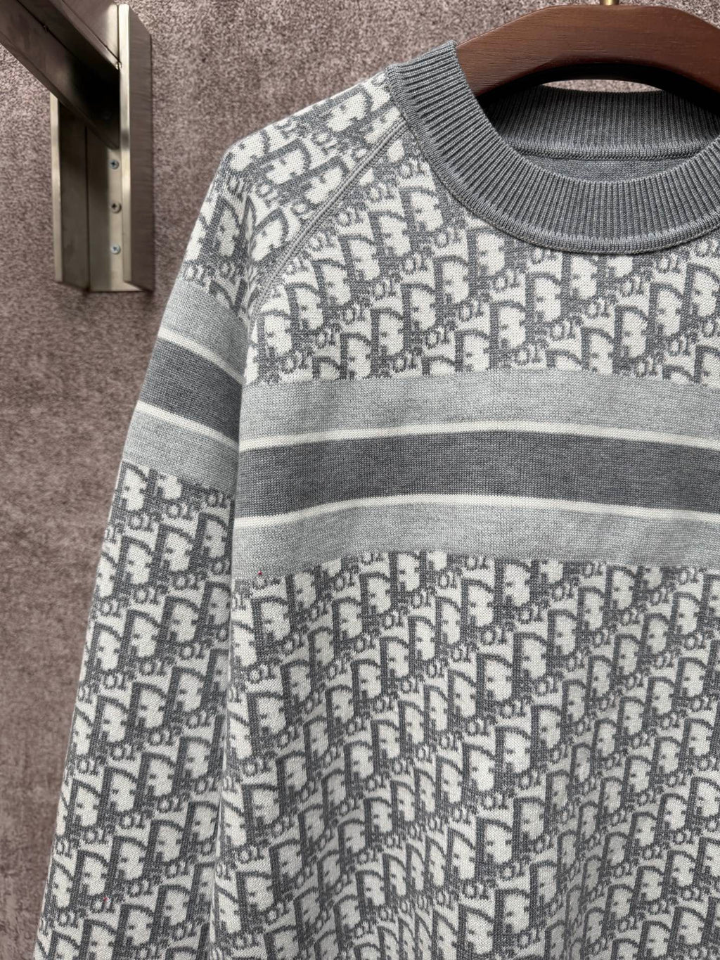 Monogram knit sweater with gray striped yoke and repeating Dior logo pattern