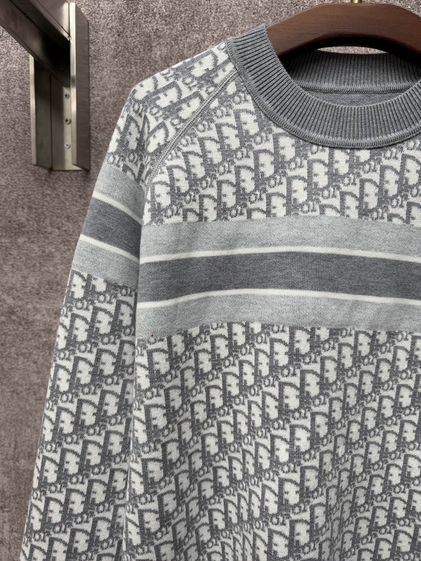 Monogram knit sweater with gray striped yoke and repeating Dior logo pattern