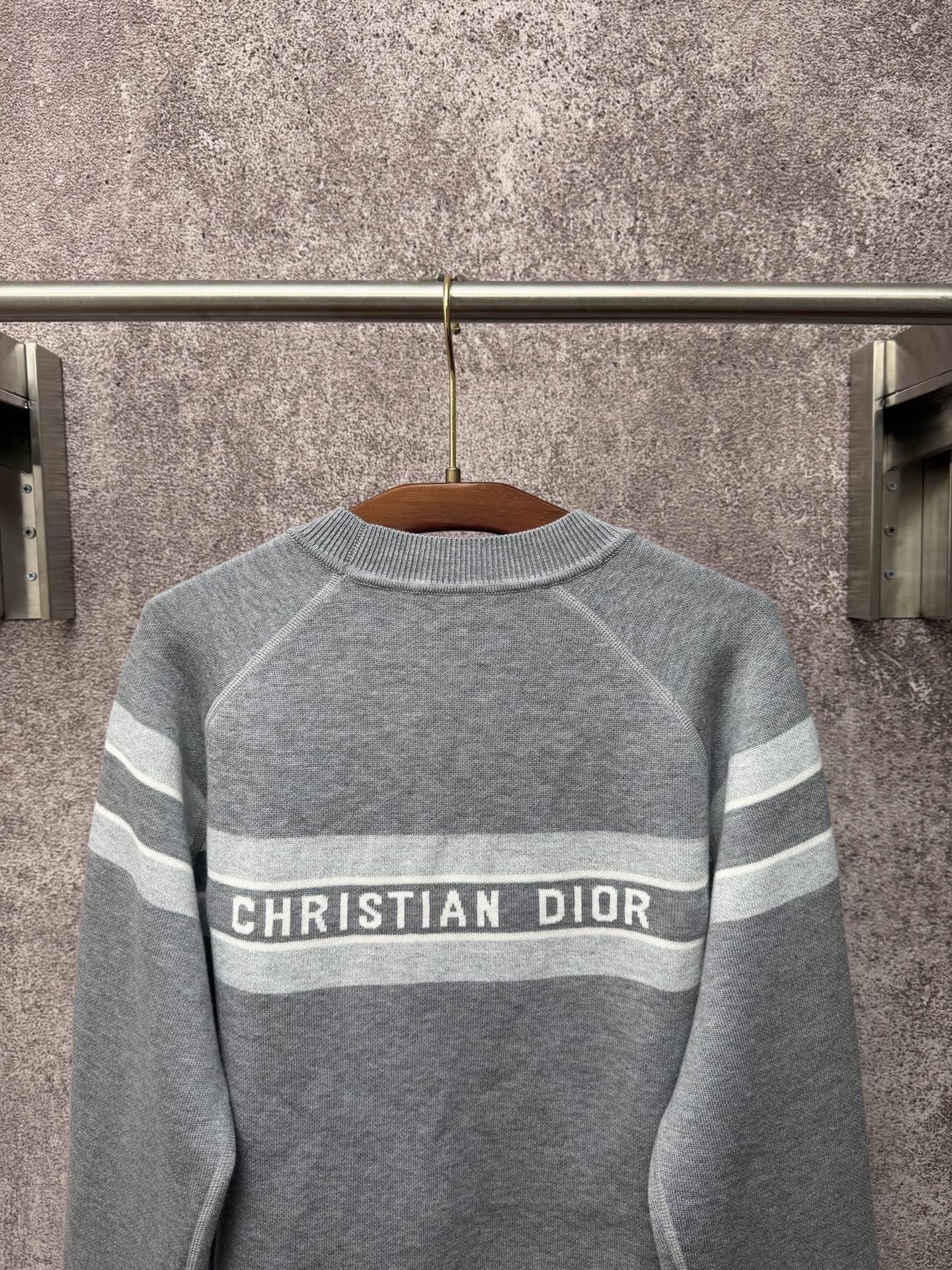 Gray long-sleeve knit sweater with Christian Dior logo band and horizontal stripes