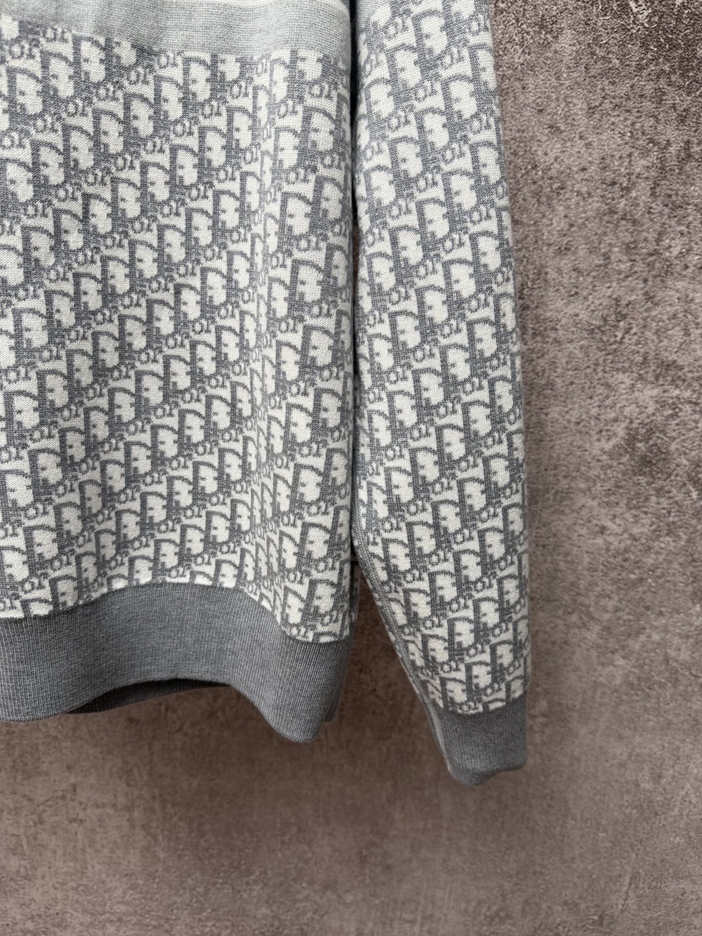 Dior long pants in light blue and gray knit with repeating logo pattern
