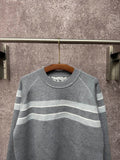 Long-sleeve knit sweater in gray with light blue and white horizontal stripes