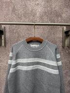 Long-sleeve knit sweater in gray with light blue and white horizontal stripes