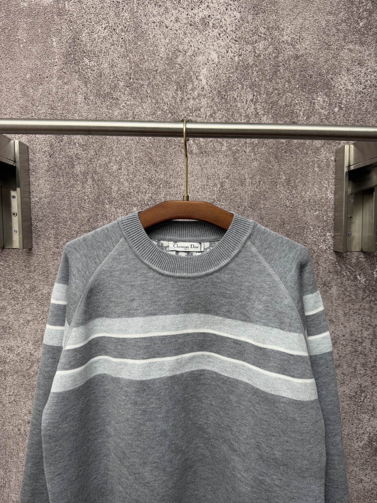 Long-sleeve knit sweater in gray with light blue and white horizontal stripes