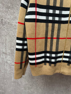 Beige plaid zip-up hoodie hem and sleeve cuff with black stripe bands and red lines