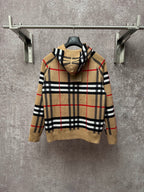 Beige plaid zip-up hoodie, attached hood, gold zipper, black and red stripe pattern