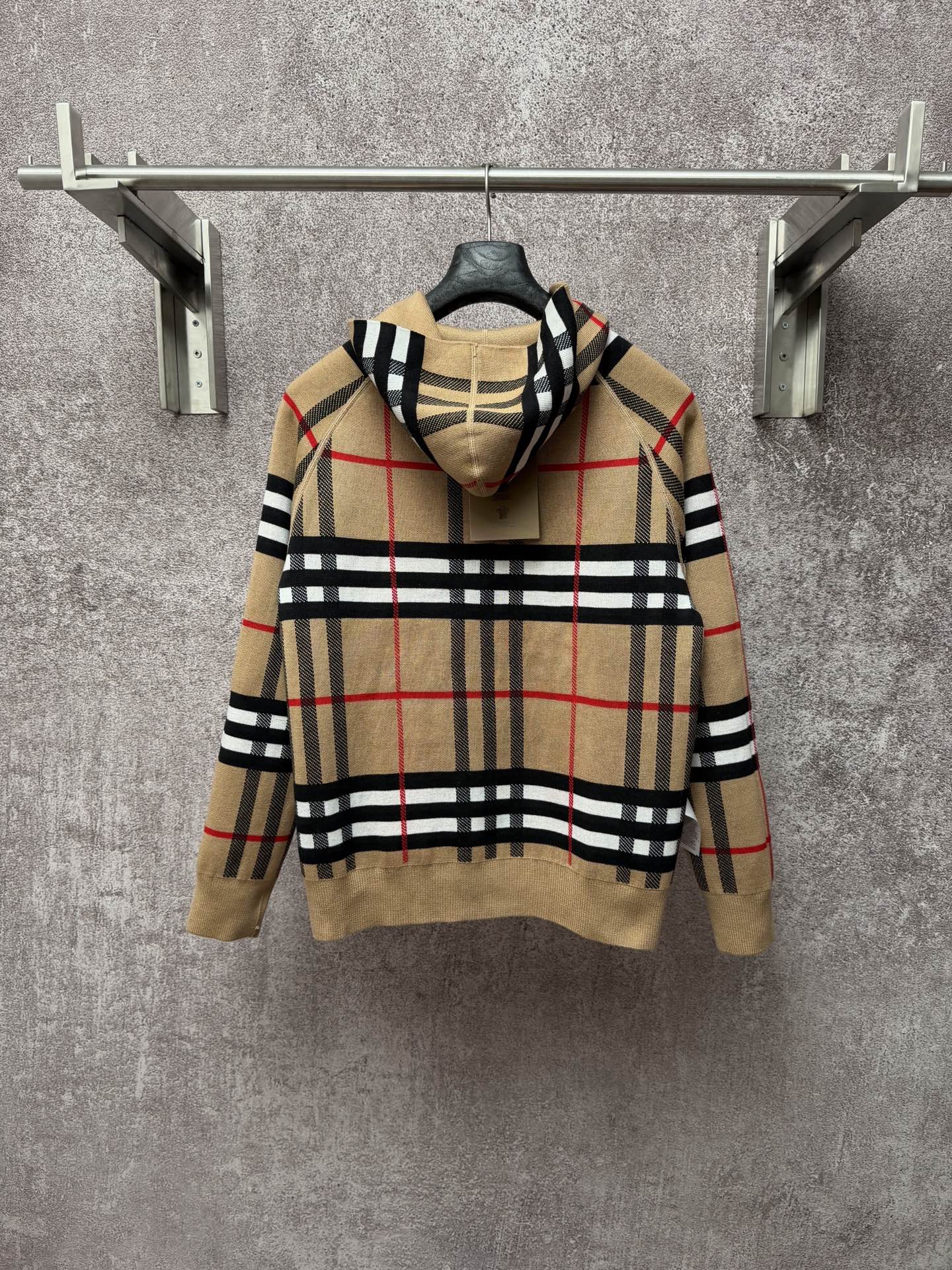 Beige plaid zip-up hoodie, attached hood, gold zipper, black and red stripe pattern