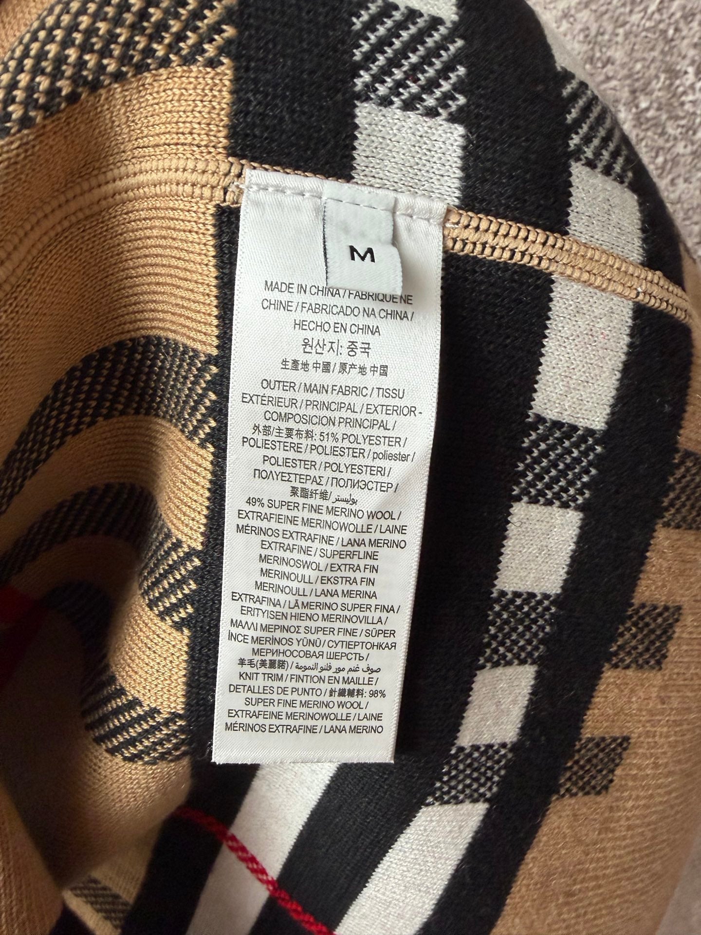 Burberry check polo shirt with care label, beige and black pattern
