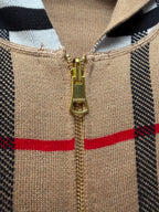 Beige knit hoodie zipper front with gold pull, black and plaid panels, hood neckline