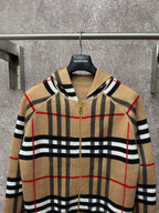 Beige plaid zip-up hoodie with attached hood, gold zipper, black and red grid stripes