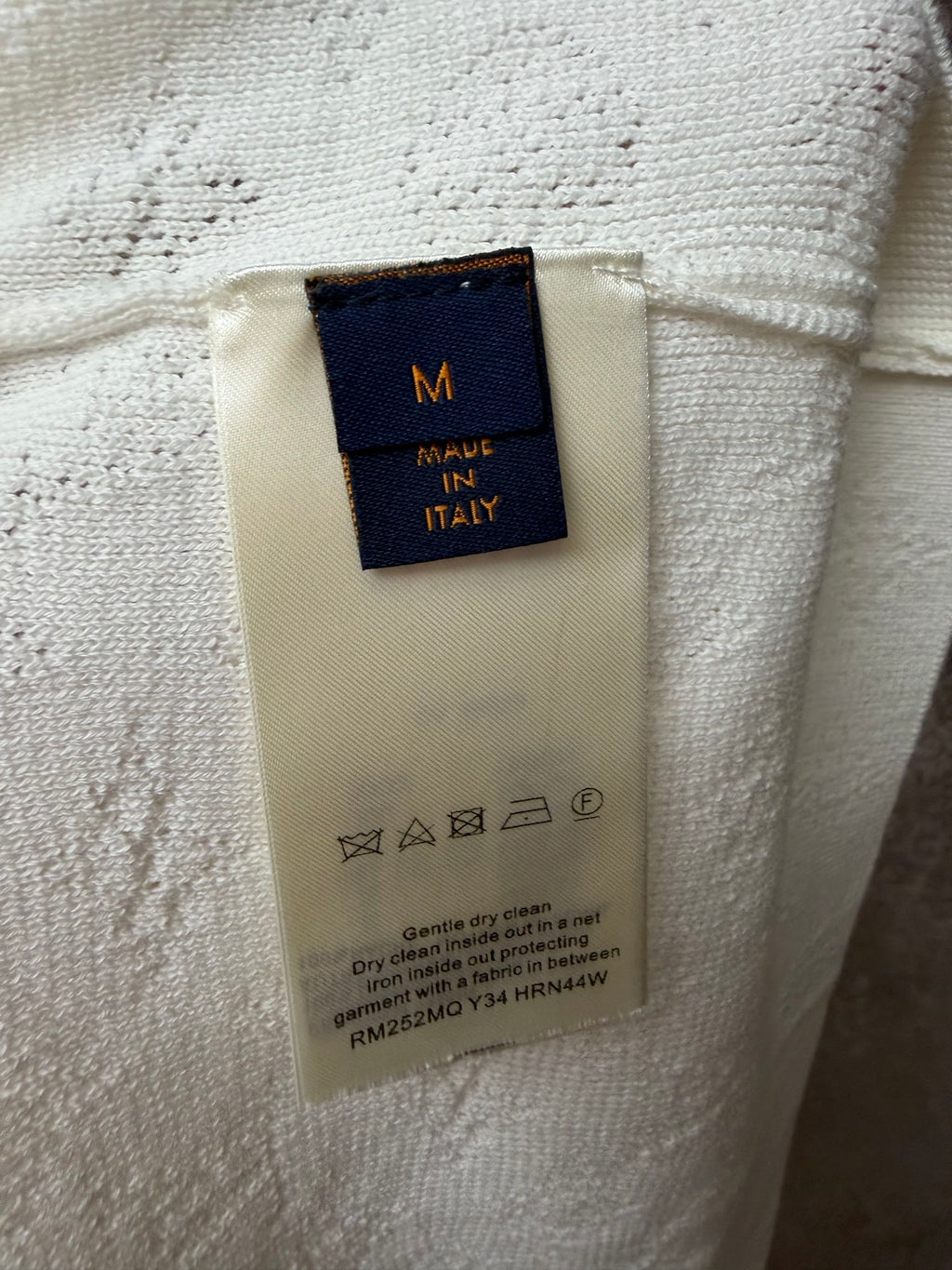 Cream care label with MADE IN ITALY and washing instructions