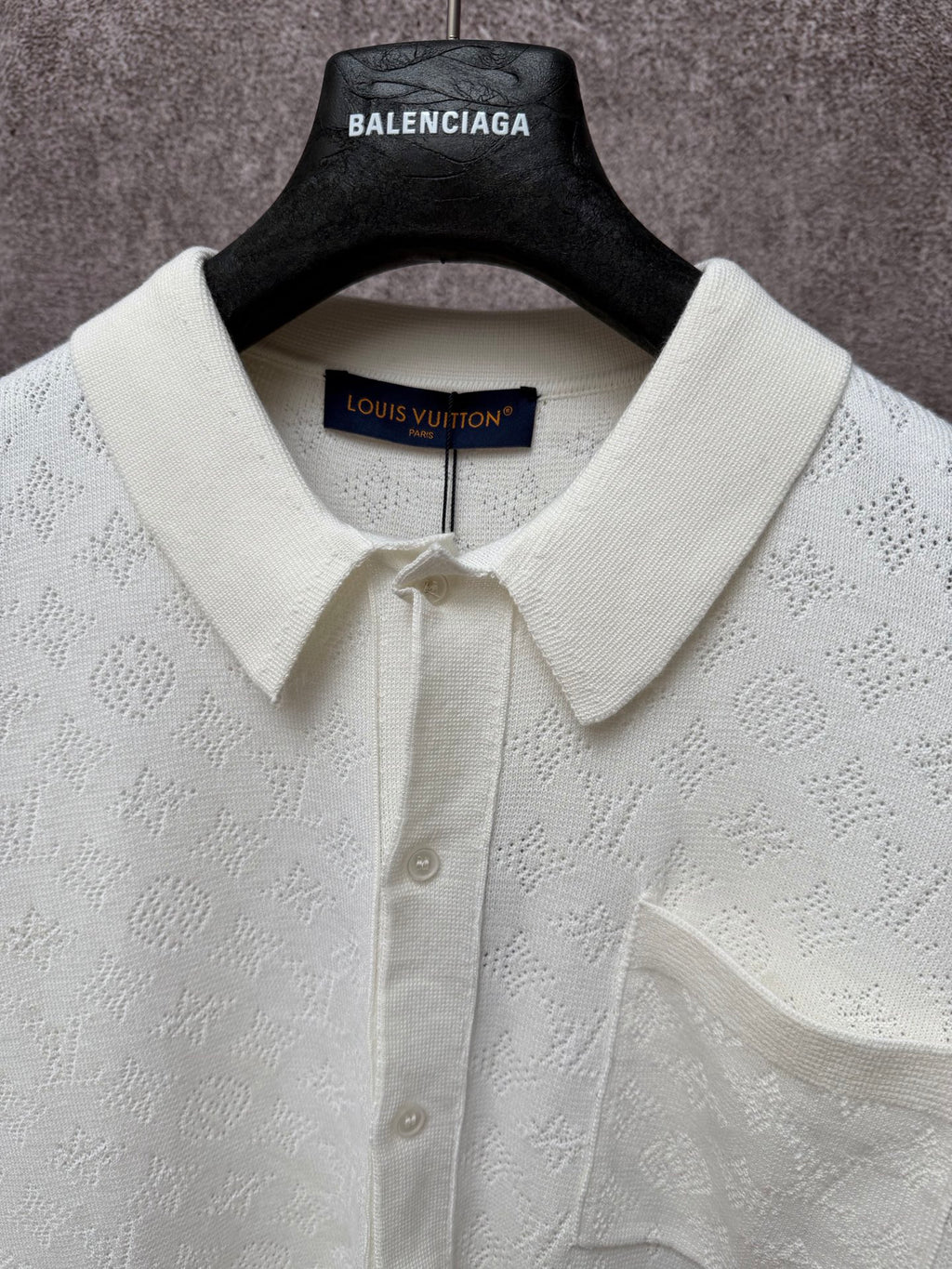 Cream polo shirt with point collar, button placket, and Louis Vuitton inner neck label