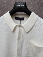 Cream polo shirt with point collar, button placket, and Louis Vuitton inner neck label