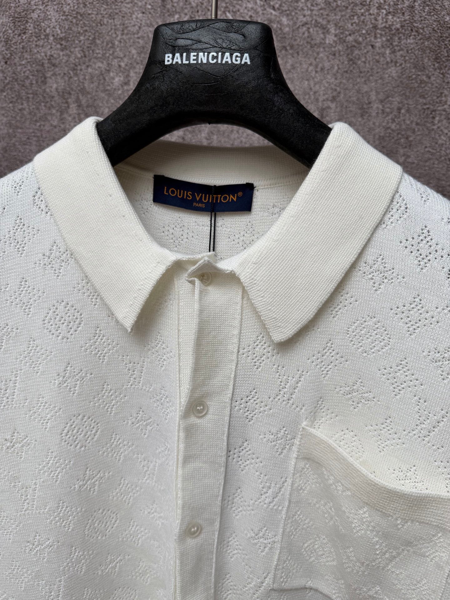 Cream polo shirt with point collar, button placket, and Louis Vuitton inner neck label