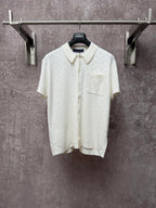 Cream short-sleeve button-up polo shirt with point collar and chest pocket