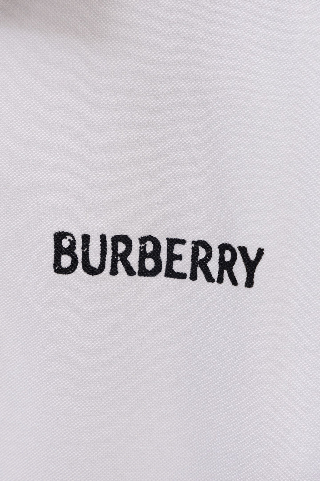 White Burberry polo shirt with BURBERRY logo on chest
