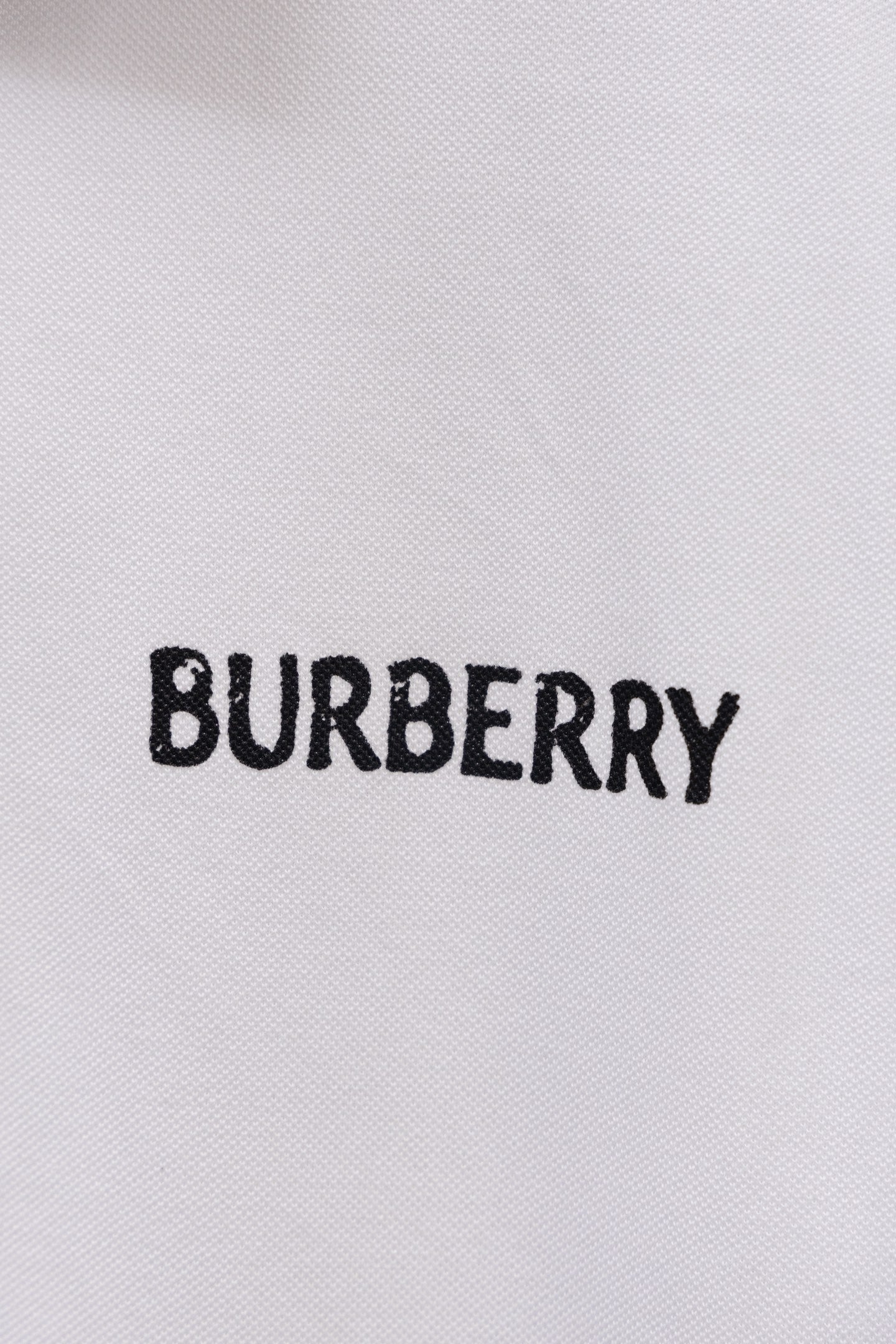 White Burberry polo shirt with BURBERRY logo on chest