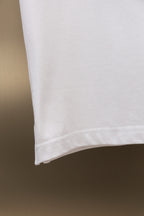 White short-sleeve shirt hem with stitched edge