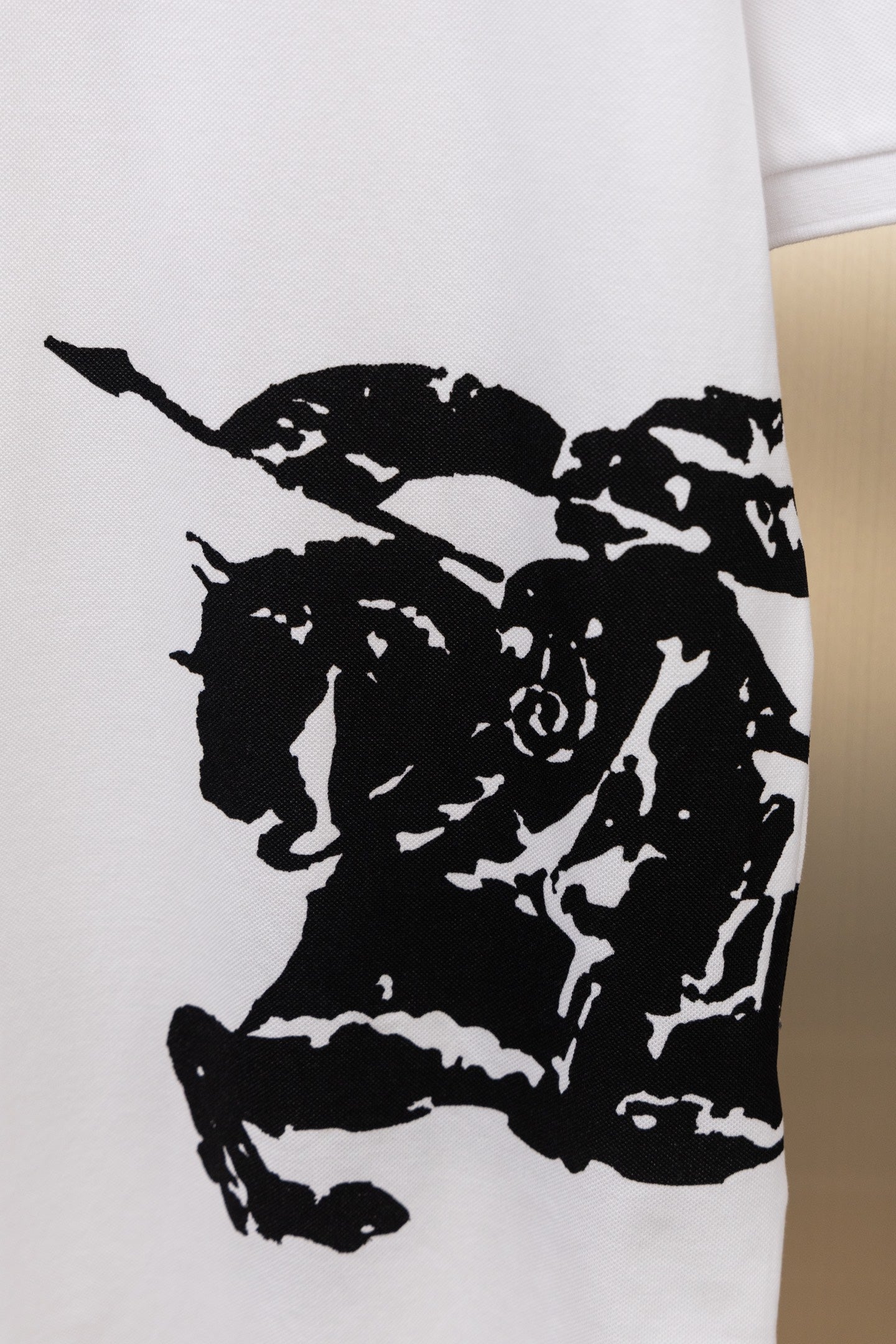 White Burberry polo shirt with black face graphic print