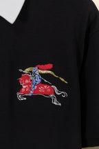 Embroidered knight-and-horse logo on black polo shirt
