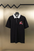 Black polo shirt with white collar and button placket, embroidered knight-and-horse logo