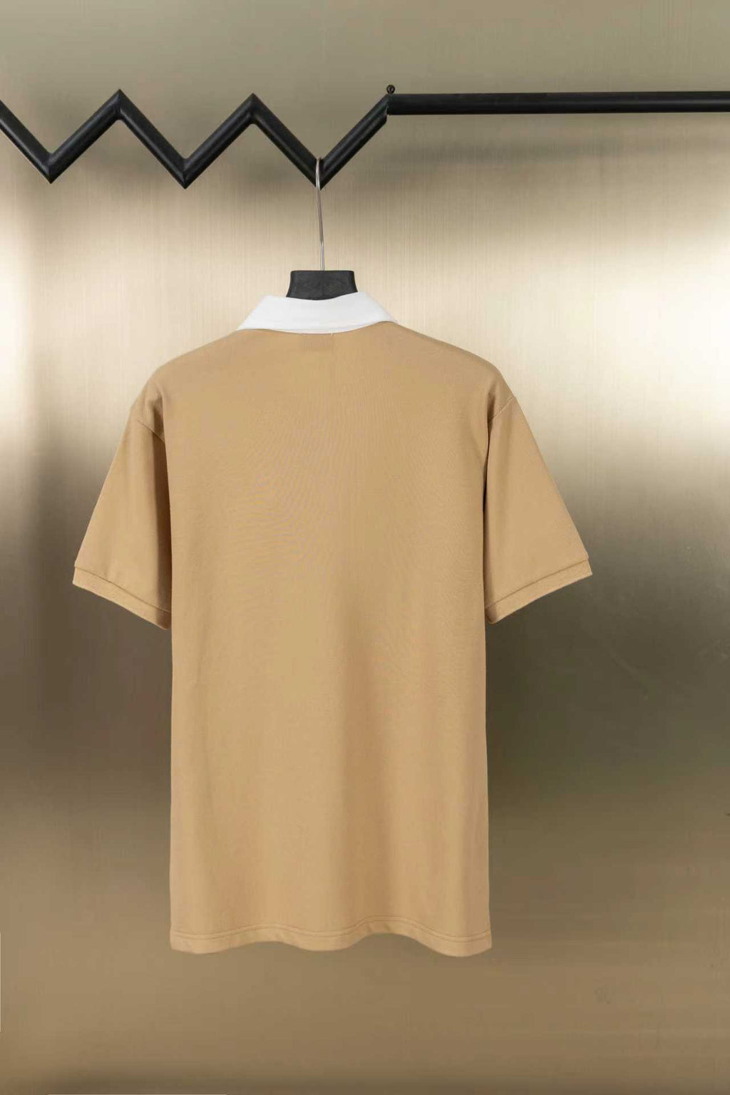 Tan short-sleeve polo shirt with white inner collar, plain back