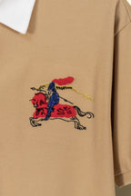 Colorful horse logo embroidery on tan polo shirt