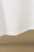White polo shirt fabric hem and side seam close-up