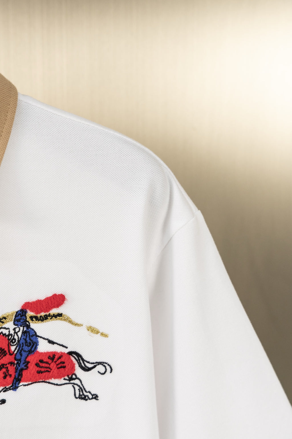 Burberry white polo shirt sleeve with chest embroidery visible