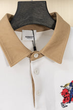 Short-sleeve polo shirt with tan collar and white button placket
