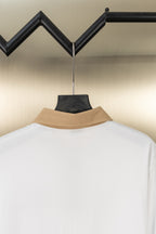 Burberry white polo shirt with tan stand collar