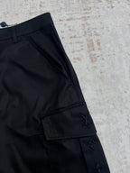 Black pants leg with side cargo pocket and Louis Vuitton emblem
