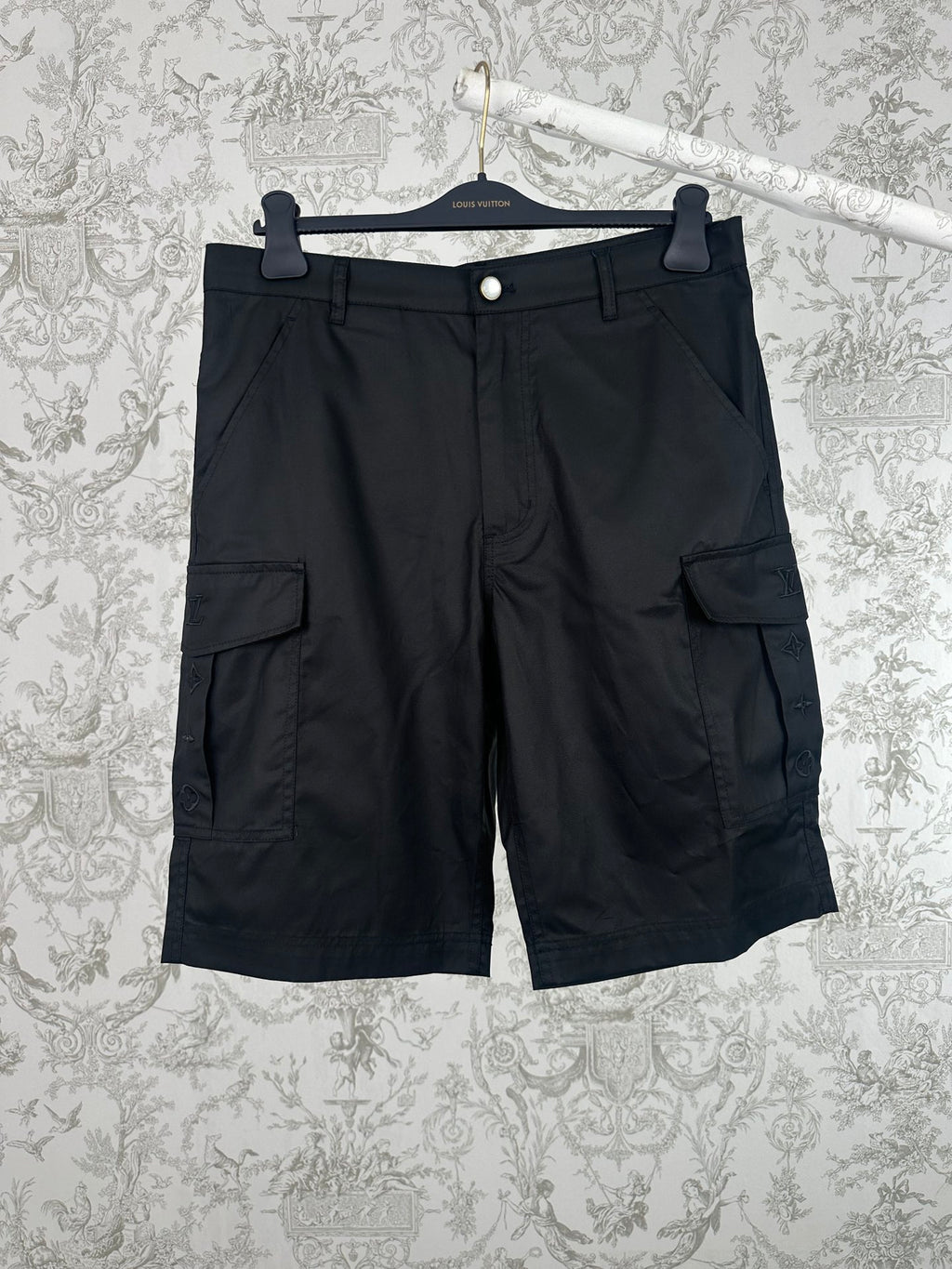 Black cargo pants with front button and utility pockets